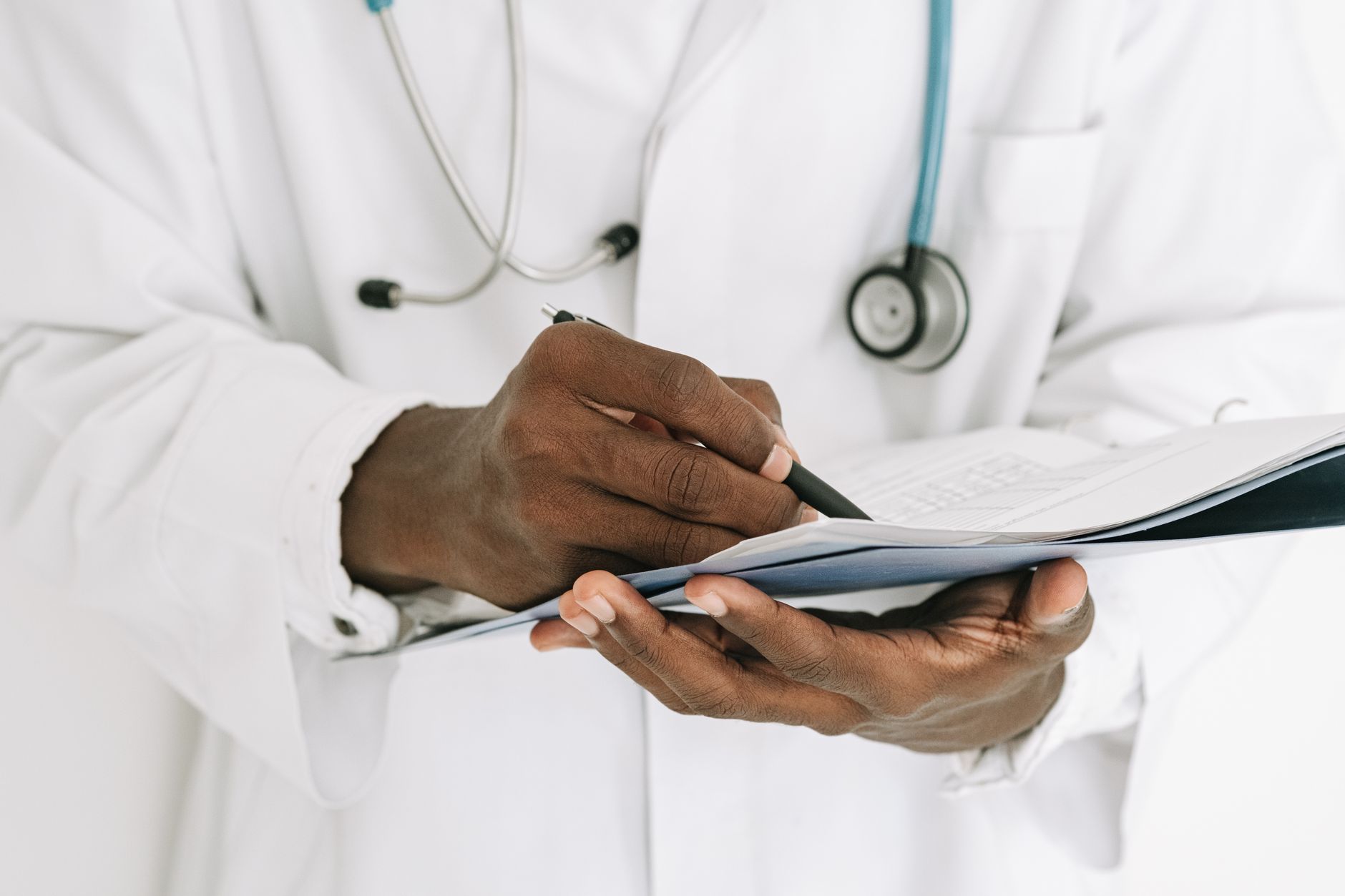 Practitioner checking on family records with focus on details
