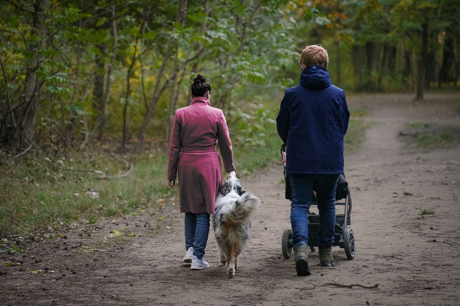 Family with small dog enjoying leisure outdoor event